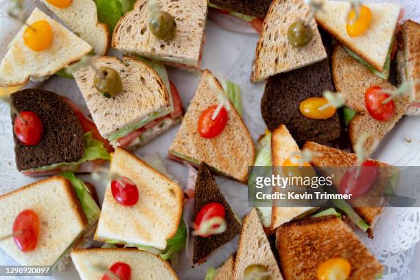 above view of platter of sandwiches - lunch buffet stock pictures, royalty-free photos & images