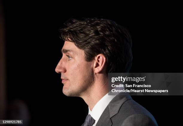 Canadian Prime Minister Justin Trudeau takes questions from reporters during a visit to the AppDirect office Thursday, Feb. 8, 2018 in San Francisco,...