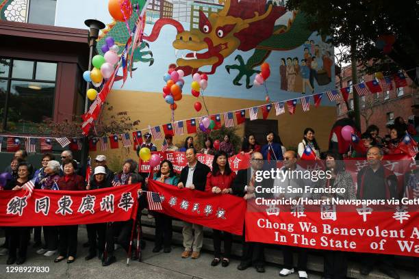 Members of the Kwong Tung Association of Washington State wait for a parade to begin, Sunday, Oct. 9, 2016. Members of the local Taiwanese community...