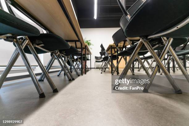 close up of chair feet in conference room - legs on the table stock pictures, royalty-free photos & images