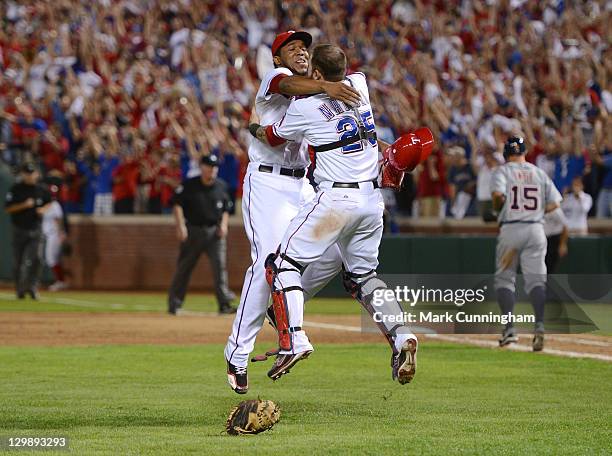 Neftali Feliz and Mike Napoli of the Texas Rangers jump into each others arms to celebrate the victory against the Detroit Tigers in Game Six of the...