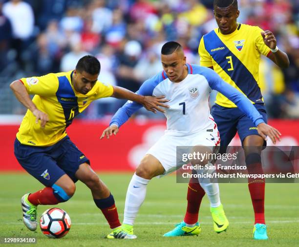 United States' Bobby Wood is sandwiched between Ecuador players Christian Noboa and Frickson Erazo during the first half of the Copa America...