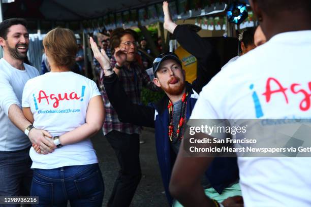 People dance at the annual Cinco de Mayo block party hosted by the Green Lake Tacos Guaymas, March 5, 2016. The party featured food, drinks, various...