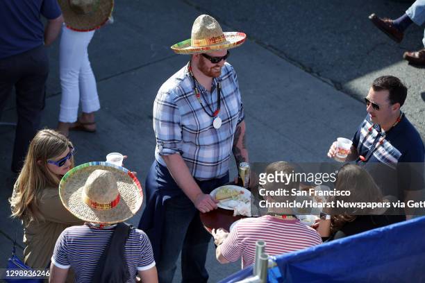 People hang out at the annual Cinco de Mayo block party hosted by the Green Lake Tacos Guaymas, March 5, 2016. The party featured food, drinks,...