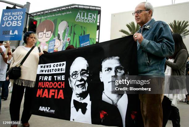 Demonstrators gather outside of Fox Studios during News Corp.'s annual shareholders meeting in Los Angeles, California, U.S., on Friday, Oct. 21,...