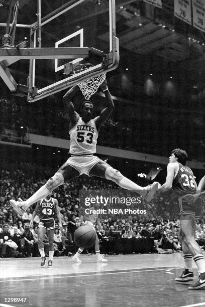 Darryl Dawkins of the Philadelphia 76'ers dunks against the Boston Celtics during an NBA game at the Spectrum in Philadelphia, Pennsylvania. NOTE TO...