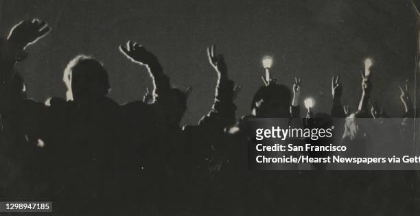 SFPAST09_ph1.jpg;;2000 people gather on the Marina Green to mourn the death of John Lennon on December 9, 1980. They raise their hands in a ""V""...