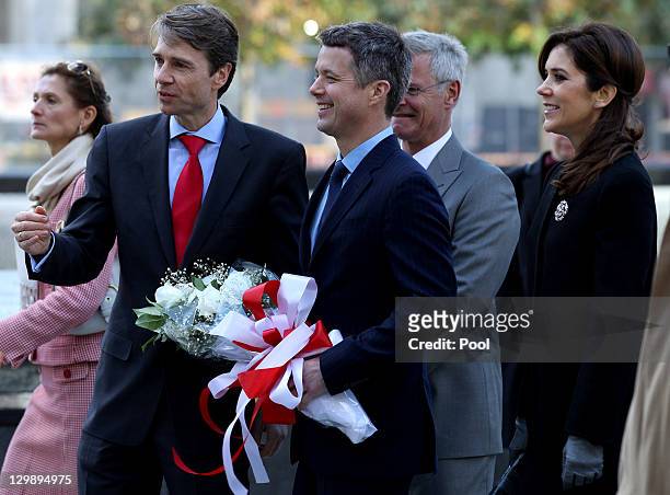 Consul General of Denmark to the U.S. Jarl Frijs-Madsen directs Crown Prince Frederik and Crown Princess Mary before a tour and ceremony at the...