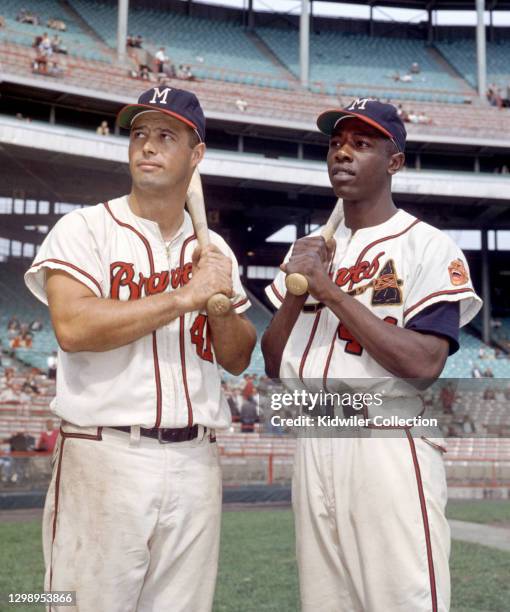 Third baseman Eddie Mathews and outfielder Hank Aaron of the Milwaukee Braves pose for a portrait prior to a game circa 1957 at County Stadium in...