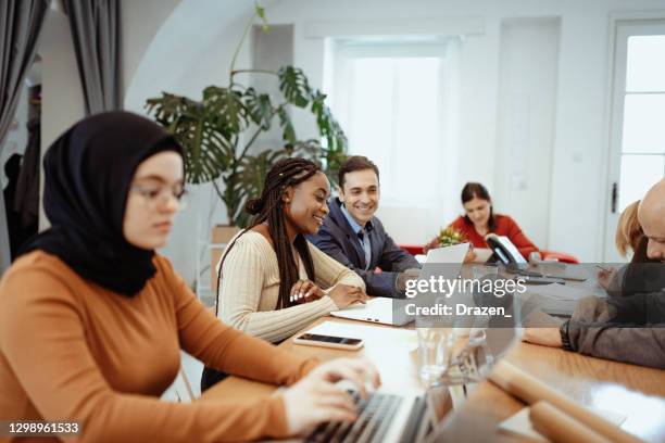 employees are happy to be together in the office after reopening - crowd funding stock pictures, royalty-free photos & images