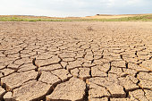 Dry and cracked land in the Loteta reservoir, Gallur, Spain.