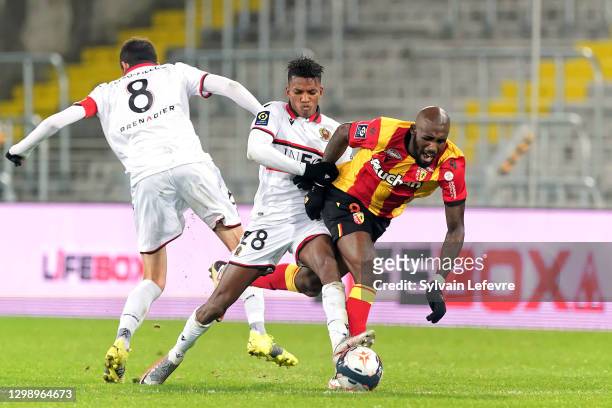 Seko Fofana of RC Lens is challenged by Hicham Boudaoui of OGC Nice during the Ligue 1 match between RC Lens and OGC Nice at Stade Bollaert-Delelis...