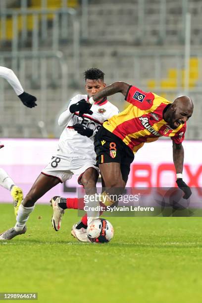 Seko Fofana of RC Lens is challenged by Hicham Boudaoui of OGC Nice during the Ligue 1 match between RC Lens and OGC Nice at Stade Bollaert-Delelis...