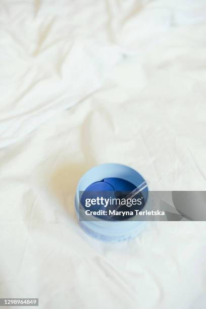 a jar of cosmetic eye patches. - eye patch stock pictures, royalty-free photos & images