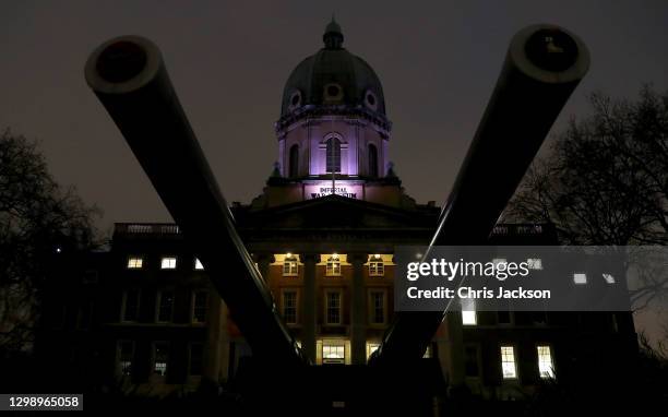 General view of the Imperial War Museum lit up in purple in respect of Holocaust Memorial Day on January 27, 2021 in London, England. Holocaust...