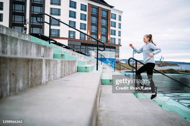 morning runner exercising at waterfront trail in pnw - hiit stock pictures, royalty-free photos & images