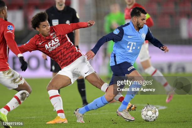 Calvin Stengs of AZ, Adam Maher of FC Utrecht during the Dutch Eredivisie match between AZ and FC Utrecht at Afas Stadium on January 27, 2021 in...