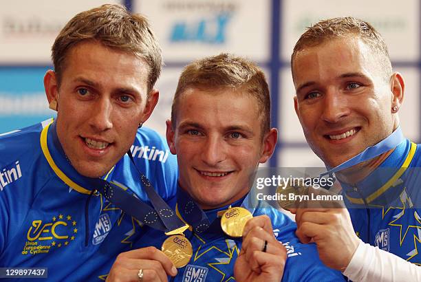 Stefan Nimke, Rene Enders and Robert Forstemann of Germany celebrate after winning the Men's Team Sprint at the 2011 Track Cycling European...