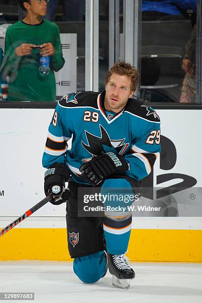 Left wing Ryane Clowe of the San Jose Sharks stretches during warm-ups against the Anaheim Ducks at the HP Pavilion on October 17, 2011 in San Jose,...