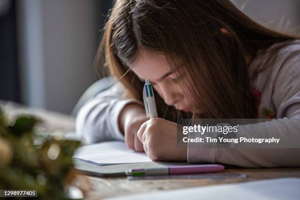 child sleeping while doing homework - left handed stock pictures, royalty-free photos & images