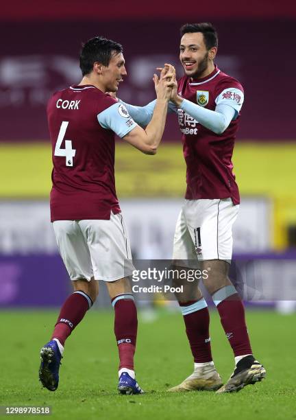 Dwight McNeil of Burnley celebrates after scoring their sides second goal with Jack Cork during the Premier League match between Burnley and Aston...