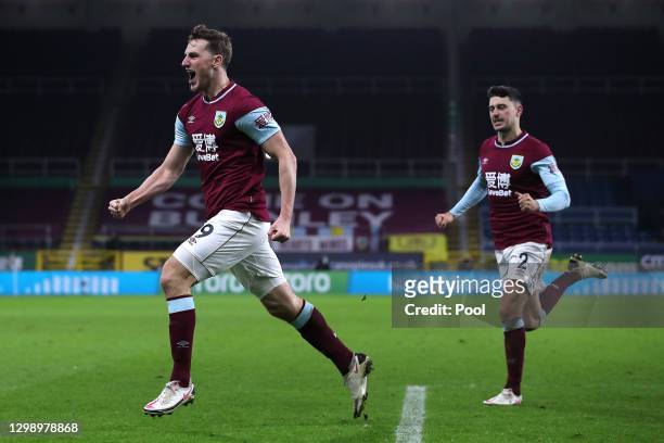 Chris Wood of Burnley celebrates after scoring their sides third goal with Matthew Lowton during the Premier League match between Burnley and Aston...
