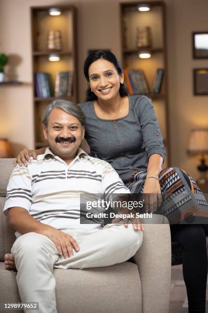 couple at home - stock photo - middle class home inside stock pictures, royalty-free photos & images
