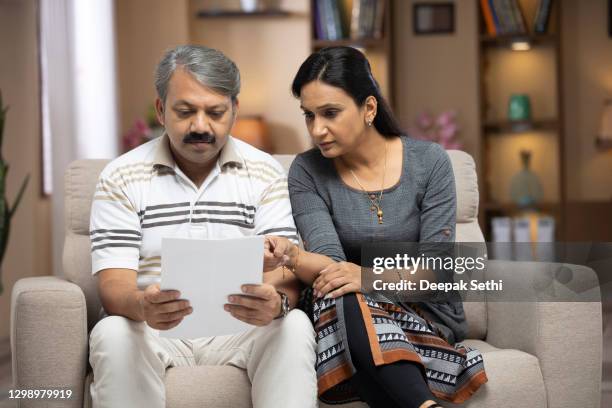 couple at home - stock photo - indian wife stock pictures, royalty-free photos & images