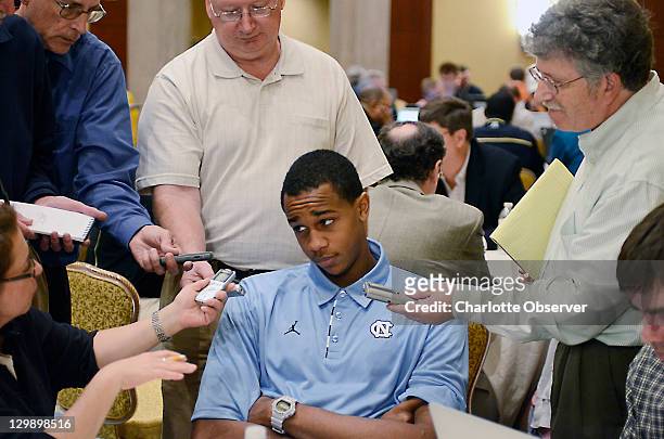 North Carolina player John Henson talks with the media during am ACC Operation Basketball event at the Ritz-Carlton in Charlotte, North Carolina,...