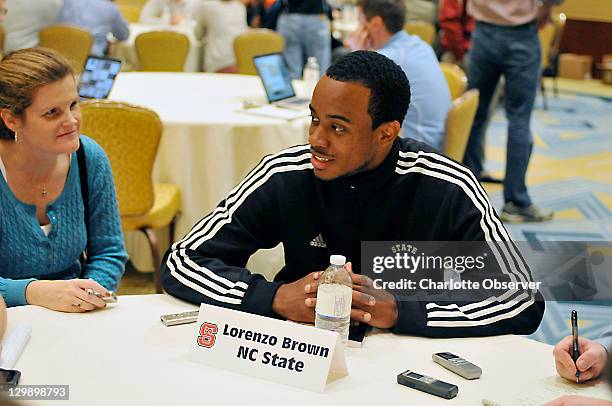North Carolina State basketball player Lorenzo Brown talks with the media during an ACC Operation Basketball event at the Ritz-Carlton in Charlotte,...