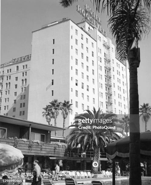 Exterior view of the Hotel Roosevelt , seen across its outdoor pool, Hollywood, California, circa 1956. The historic hotel was located across the...