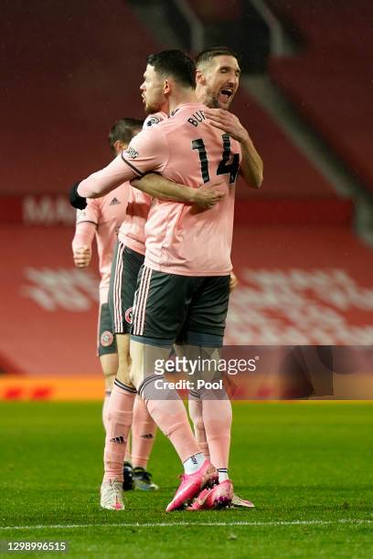 Oliver Burke of Sheffield United is congratulated by Chris Basham of Sheffield United after scoring their sides second goal during the Premier League...