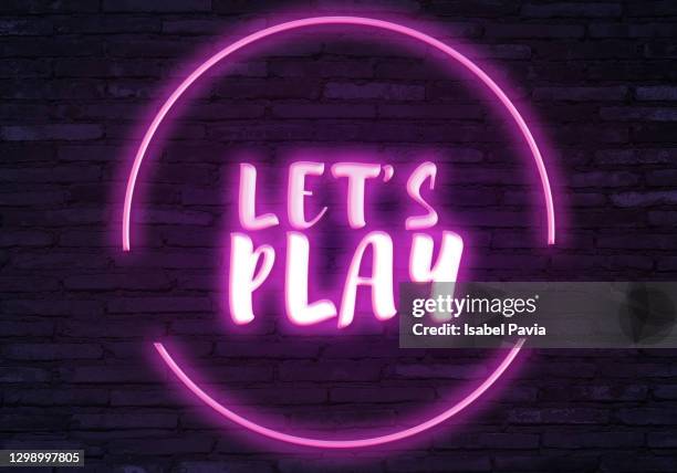 let's play sign in neon lights - playful font stock pictures, royalty-free photos & images