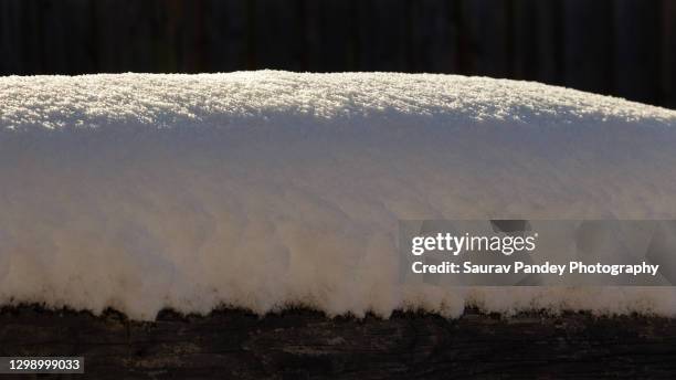 snow pile - schneehaufen stock-fotos und bilder