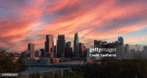 dtla at sunset with a pink color sky - los angeles dusk stock pictures, royalty-free photos & images