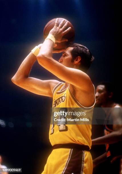 Jerry West of the Los Angeles Lakers takes the shot during an NBA game against the New York Knicks circa 1971 at the Forum in Inglewood, California.