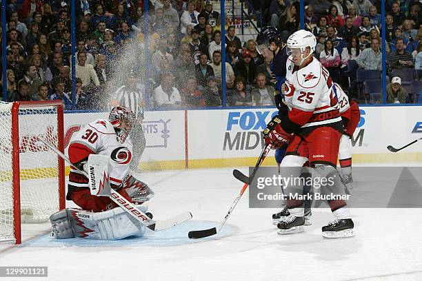 Goalie Cam Ward of the Carolina Hurricanes makes a save in an NHL game against the St. Louis Blues on October 21, 2011 at Scottrade Center in St....