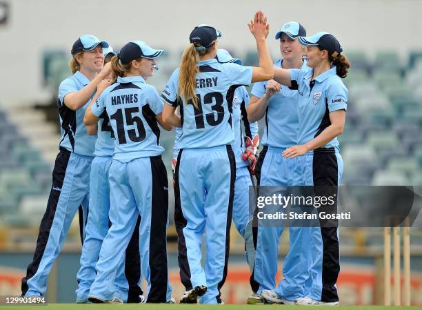 The Breakers team celebrate the dismissal of Jenny Wallace of the Fury during the WNCL match between the West Australia Fury and the New South Wales...