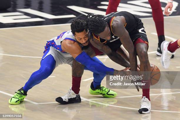 Derrick Rose of the Detroit Pistons battles Taurean Prince of the Cleveland Cavaliers for a loose ball during the second quarter at Rocket Mortgage...