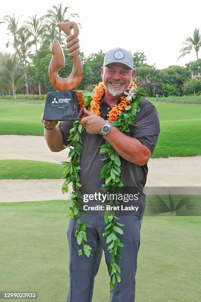 Darren Clarke of Northern Ireland celebrates with the trophy after winning the Mitsubishi Electric Championship at Hualalai on January 24, 2021 in...