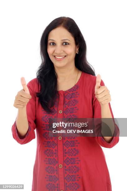 cheerful indian woman with thumbs up gesture - okサイン　女性 ストックフォトと画像