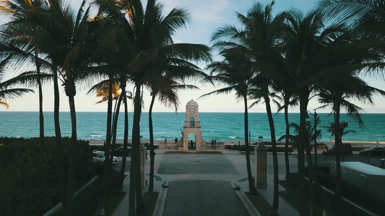 https://media.gettyimages.com/id/1299027417/video/aerial-footage-of-palm-trees-surrounding-the-worth-avenue-clock-tower-on-palm-beach-fl-during.jpg?b=1&s=640x640&k=20&c=1uTSILHqm8kuE9oUE7XMa5OJP__enE92-2DxKnWwfQM=