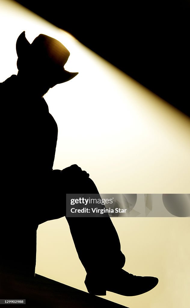 Cowboy with boot and hat silhouette