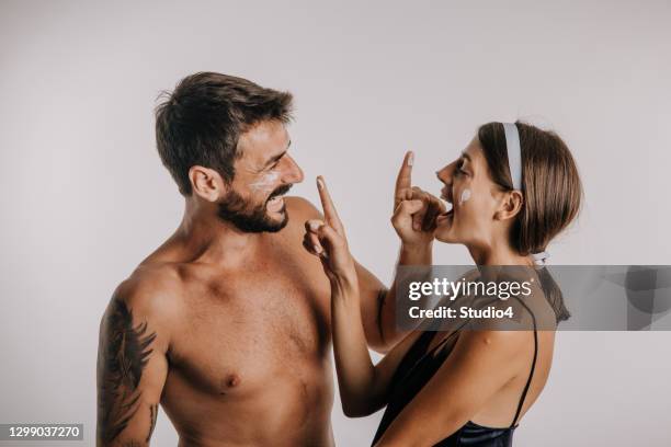 man and woman taking care of each other’s skin care - men skin care stock pictures, royalty-free photos & images