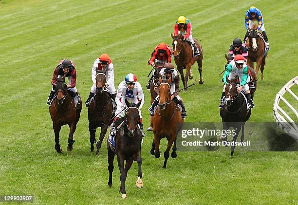 Jockey Gerald Mosse riding Americain wins Race 6 the Drake International Cup during Cox Plate Day at Moonee Valley Racecourse on October 22, 2011 in...