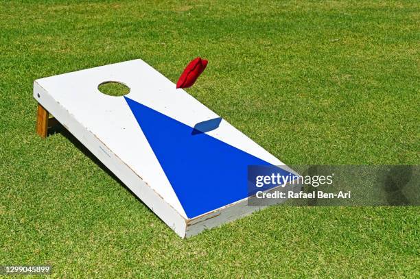 outdoor aiming target game - corn hole stock pictures, royalty-free photos & images