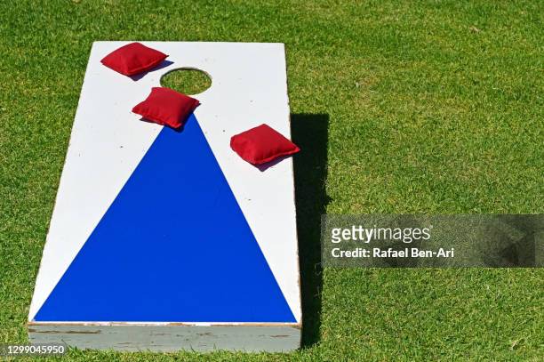 outdoor aiming target game - corn hole stock pictures, royalty-free photos & images
