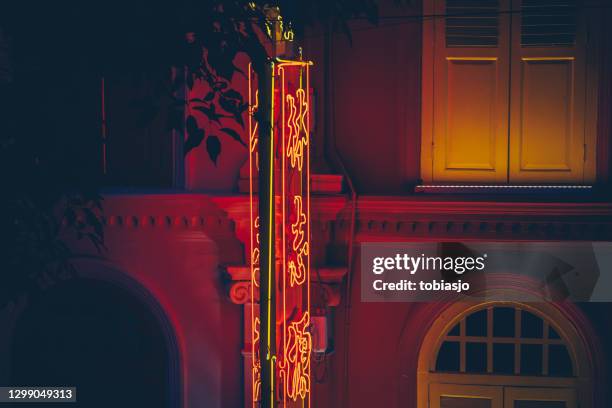 neon chinese signs in the shady night - singapore alley stock pictures, royalty-free photos & images