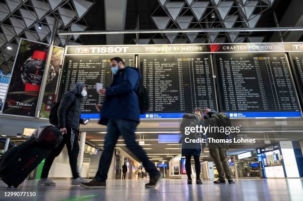 Passengers pictured in the Terminal 1 of the Frankfurt Airport on January 28, 2021 in Frankfurt, Germany. Border police check passengers arriving...