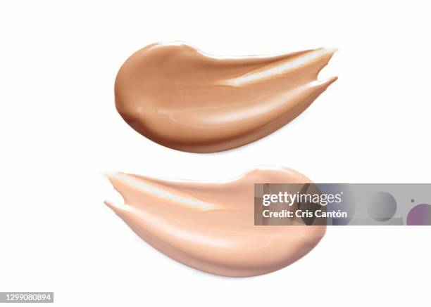 dark and light liquid foundation samples on white background - amostra de cor imagens e fotografias de stock